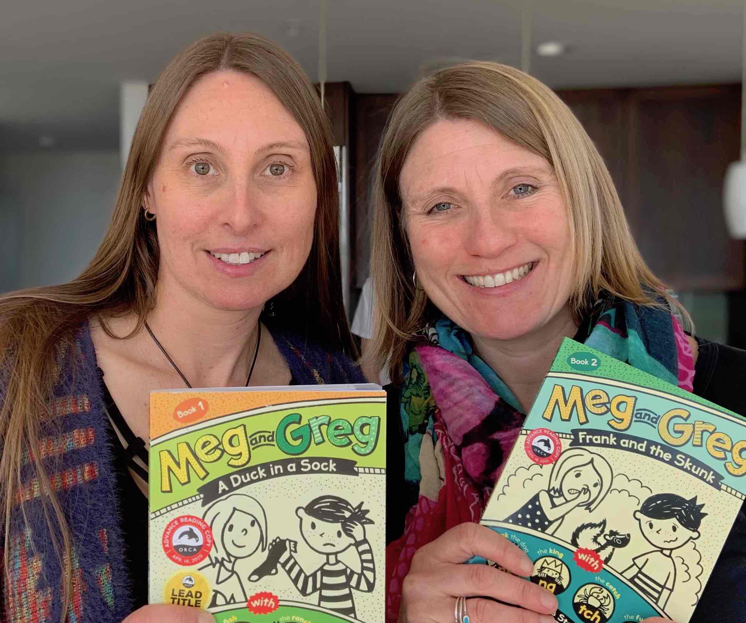 Rowena Rae and Elspeth Rae holding books from the Meg and Greg series
