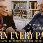 Two Men, Robert Caro And Robert Gottlieb, Facing Each Other With Bookshelf In The Background.