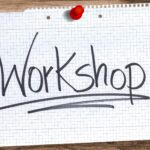 The Word "Workshop" Written And Underlined On A Torn Piece Of Paper.