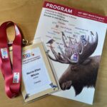 A conference program and lanyard.